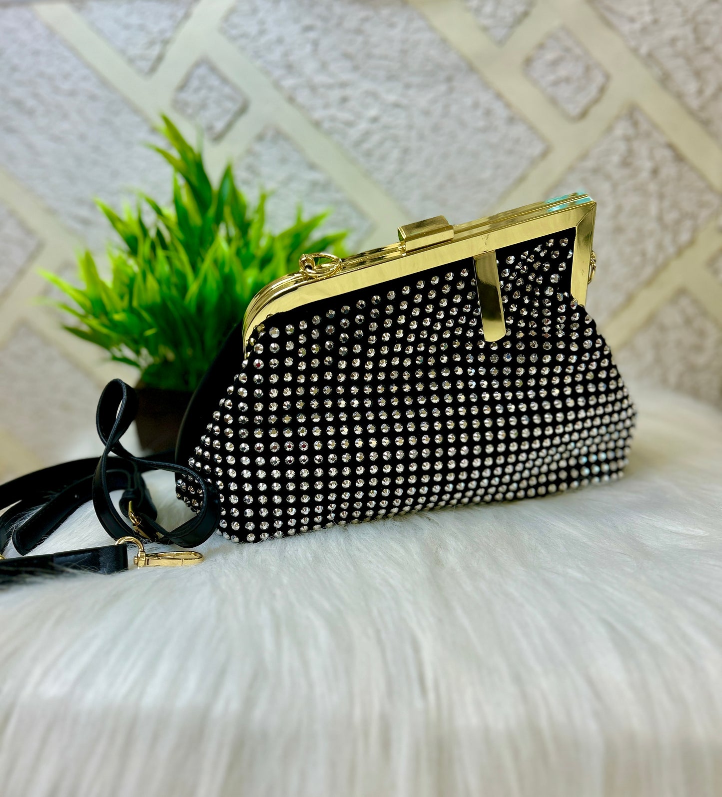 Diamond studded black leather clutch