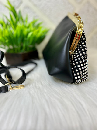 Diamond studded black leather clutch