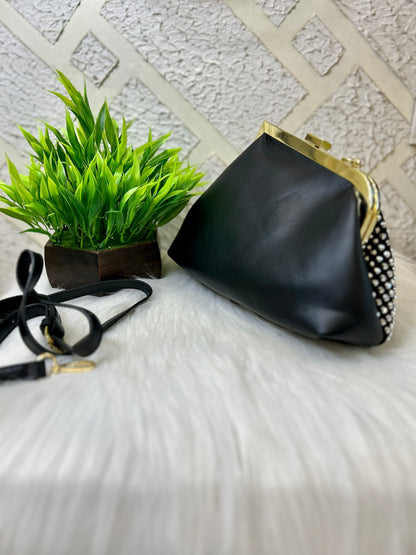 Diamond studded black leather clutch