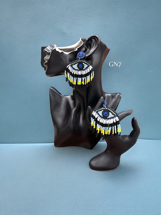 Evil eye black yellow tassel earrings