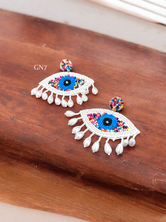 White tassel evil eye quirky earrings