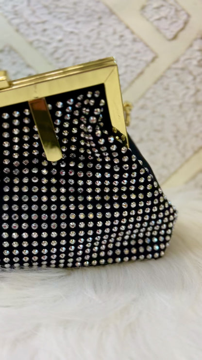 Diamond studded black leather clutch